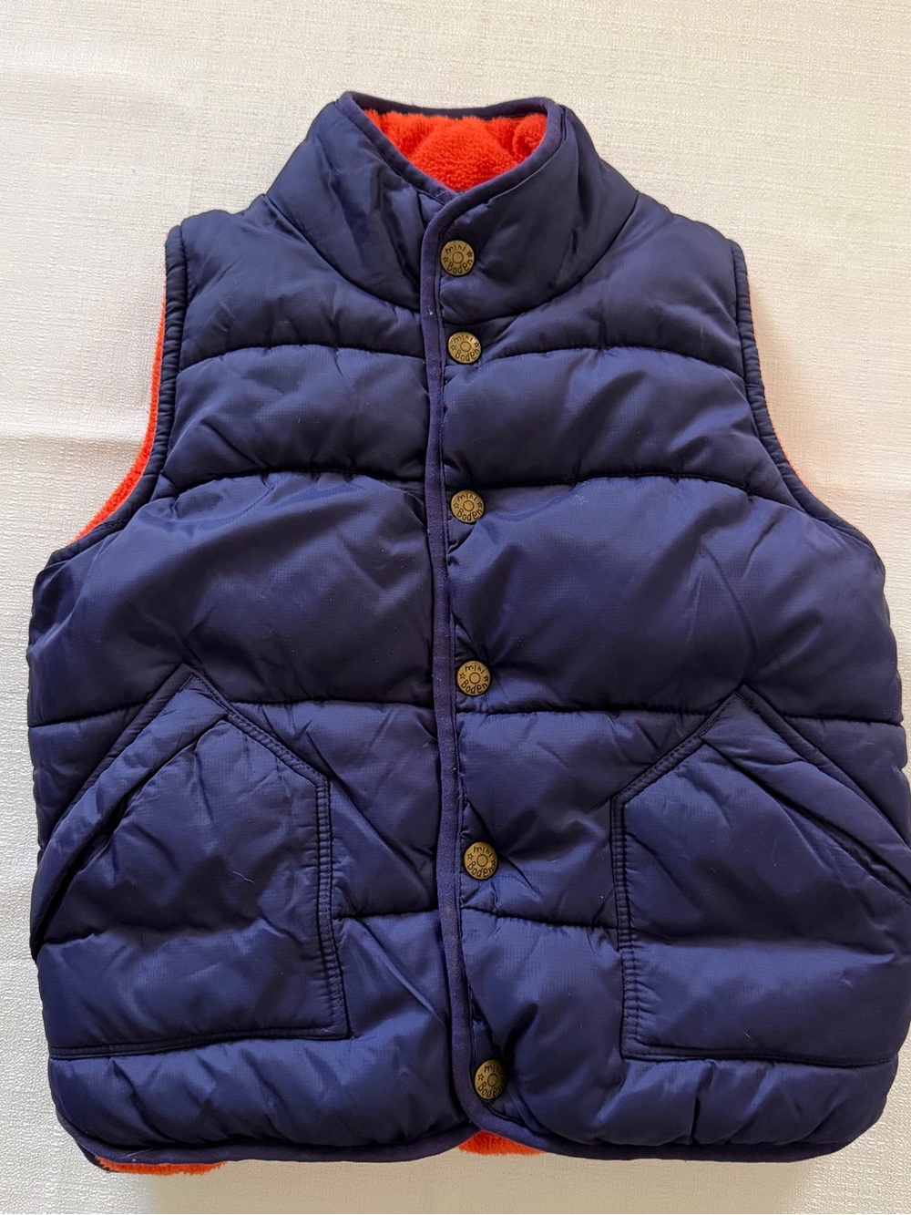 Mini Boden navy blue puffer vest with orange lining
